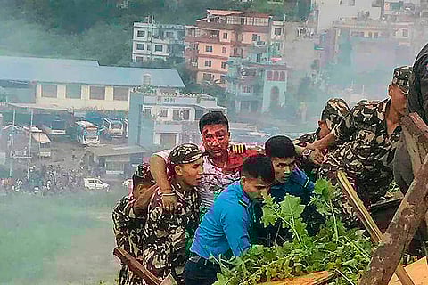 Injured pilot of the Saurya Airlines being rescued